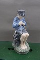 Royal Copenhagen porcelain figurine No 905, Boy 
cutting stick.
