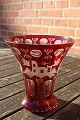 Bohemian glass. Ruby red vase with cuttings and 
nice decoration