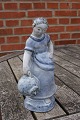 Hjorth Danish stoneware figurine in blue glaze. Girl with jar